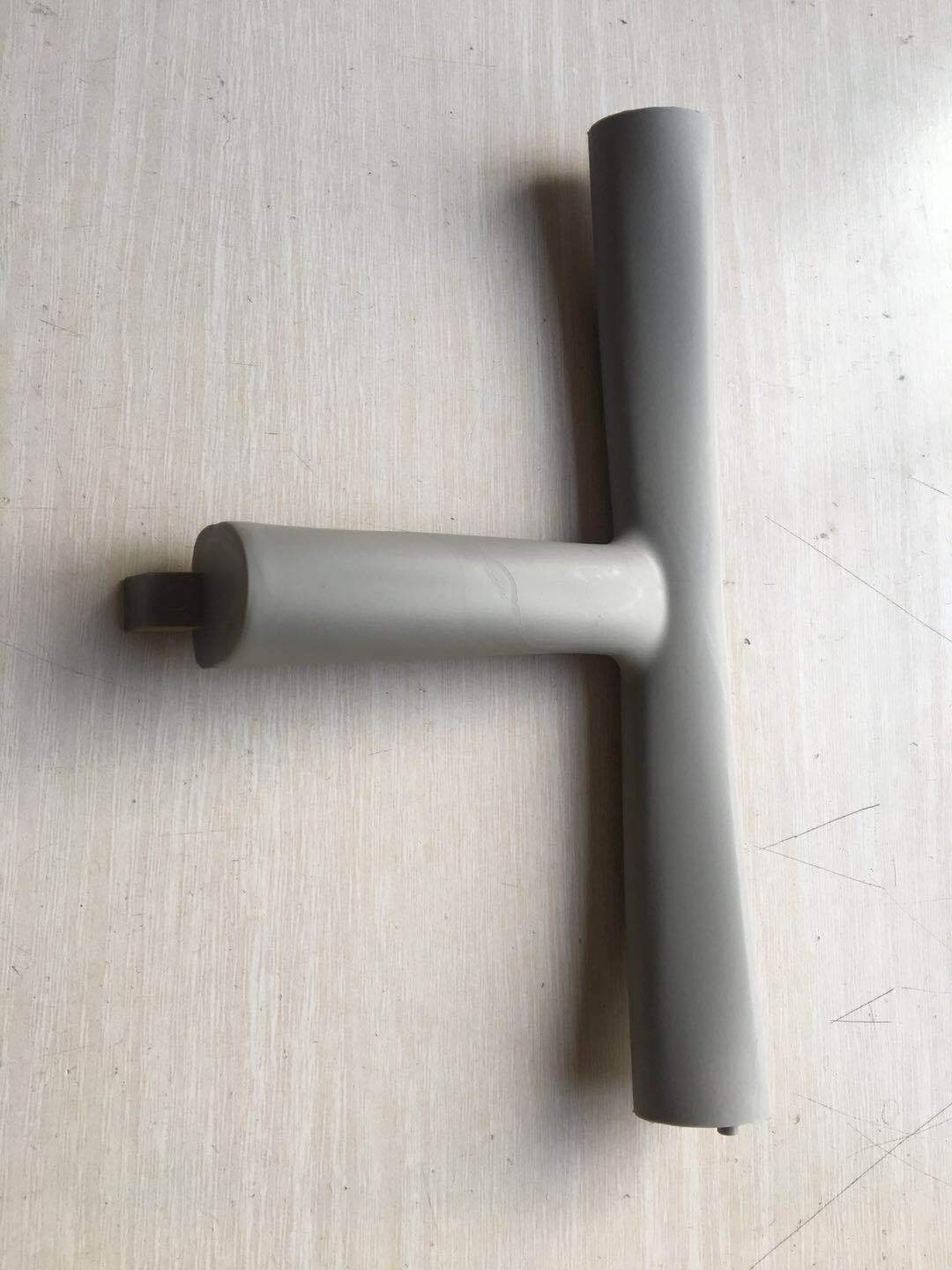 Gray metal pipe on a textured surface