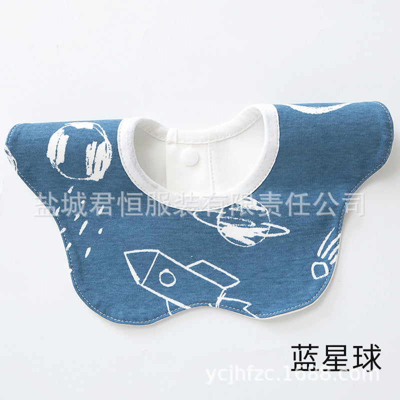 Blue bib with white rocket design on a white background