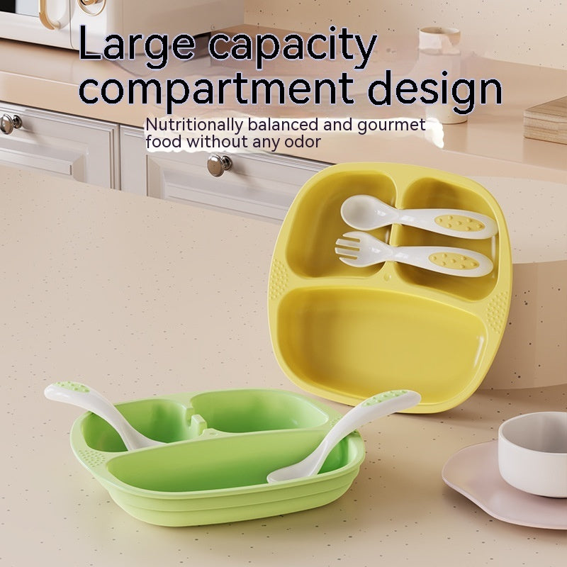 Yellow and green compartmentalized plates with utensils on a kitchen counter.