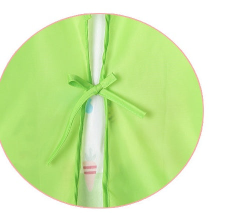 Green protective cover with a bow around a pen on a white background