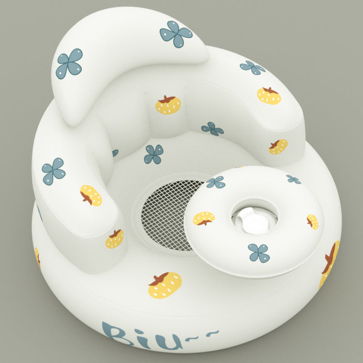 White baby seat with floral and fruit patterns on a gray background