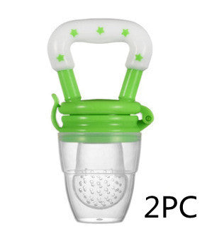 Green and clear baby teether with green handle on a white background