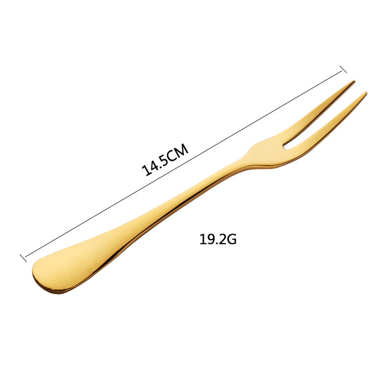 Gold-colored fork with measurements on a white background