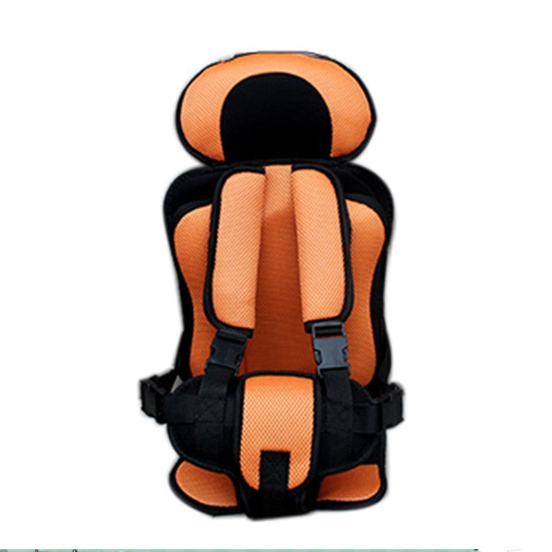 Orange and black child safety seat on a white background