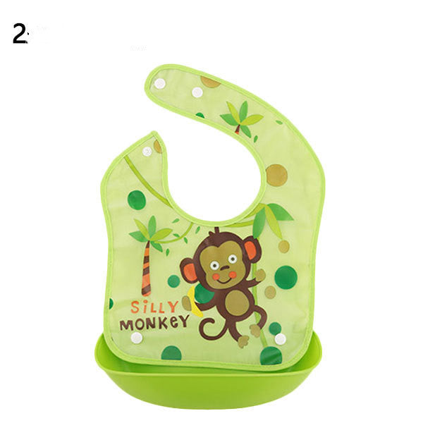 Green baby bib with monkey design and 'Silly Monkey' text on a white background