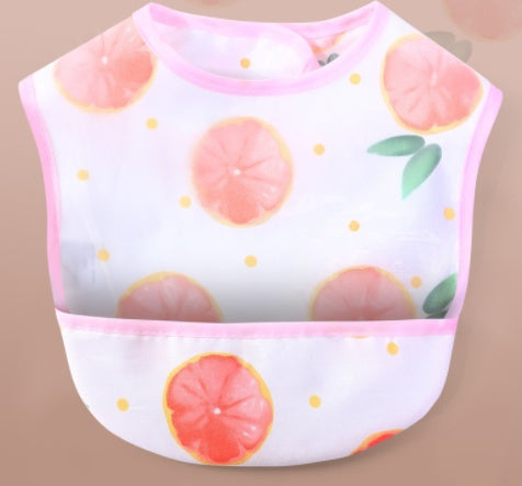 Baby bib with grapefruit pattern on a beige background