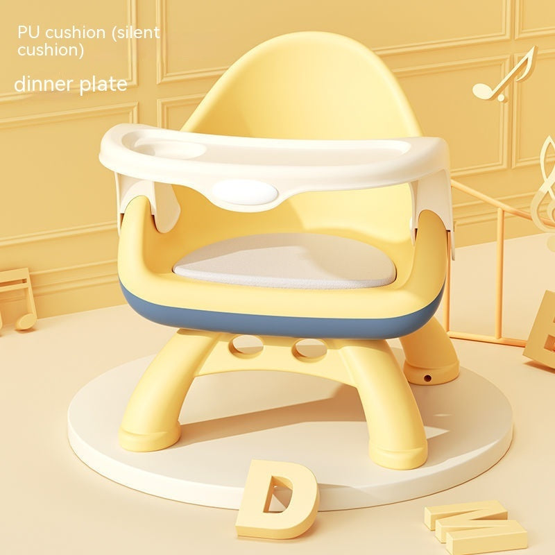 Yellow and white children's chair with cushion on a light background