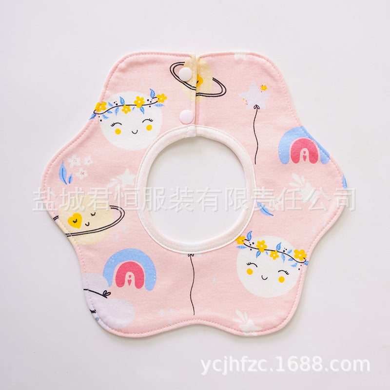 Pink bib with cartoon designs on a light pink background