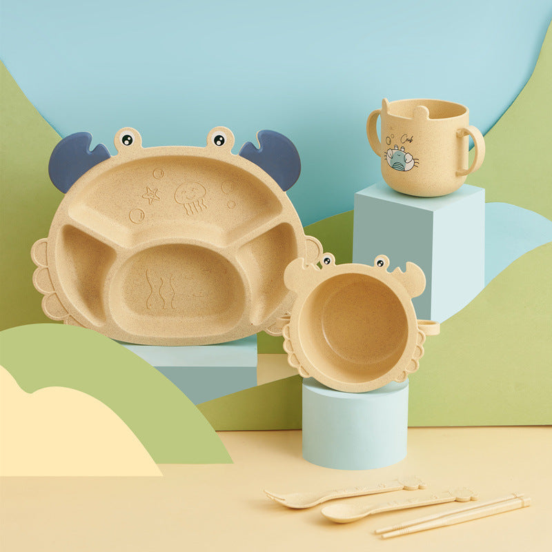 Children's tableware set with a bowl, cup, and spoon on a colorful background