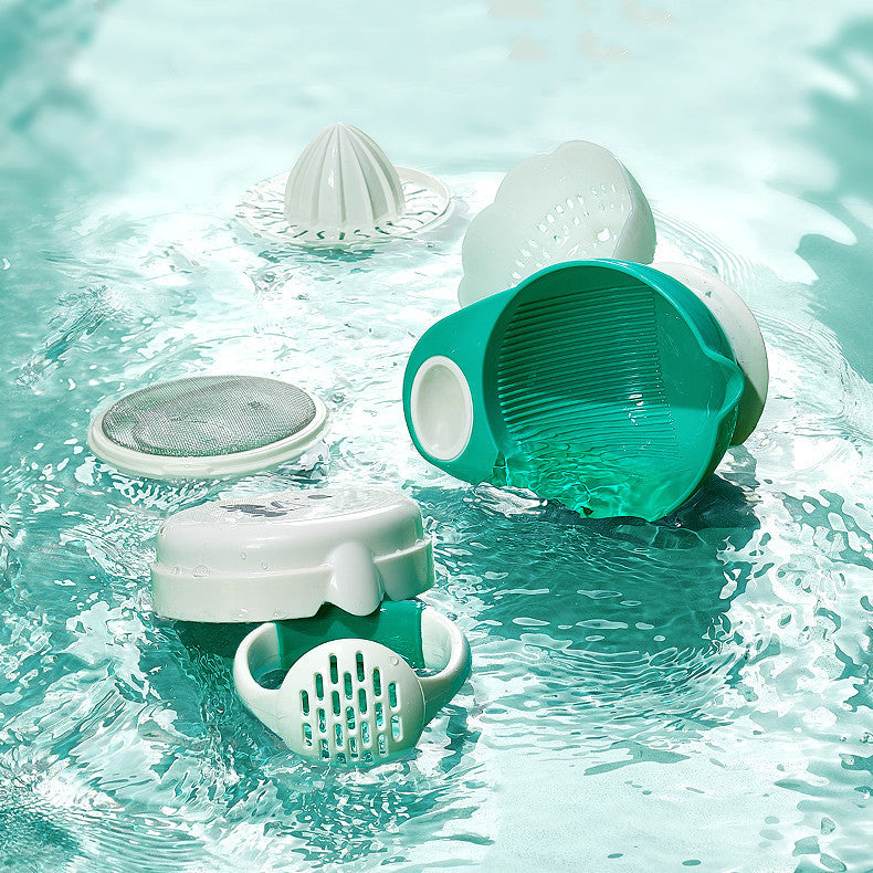 Pool cleaning tools including a green and white scrubber and filter in clear water.