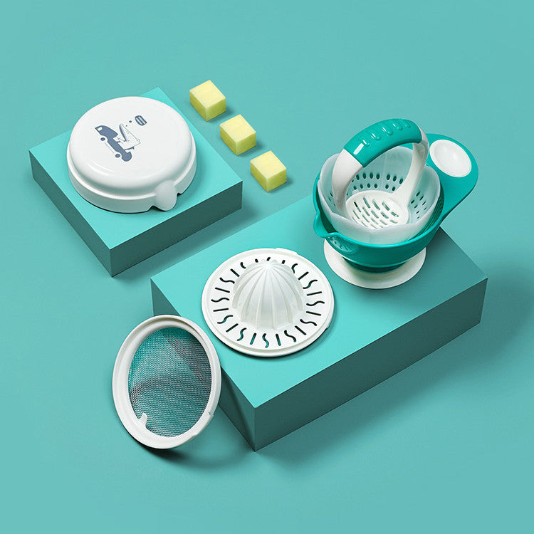 Set of kitchen tools including a white lid, green strainer, and other components on a teal background