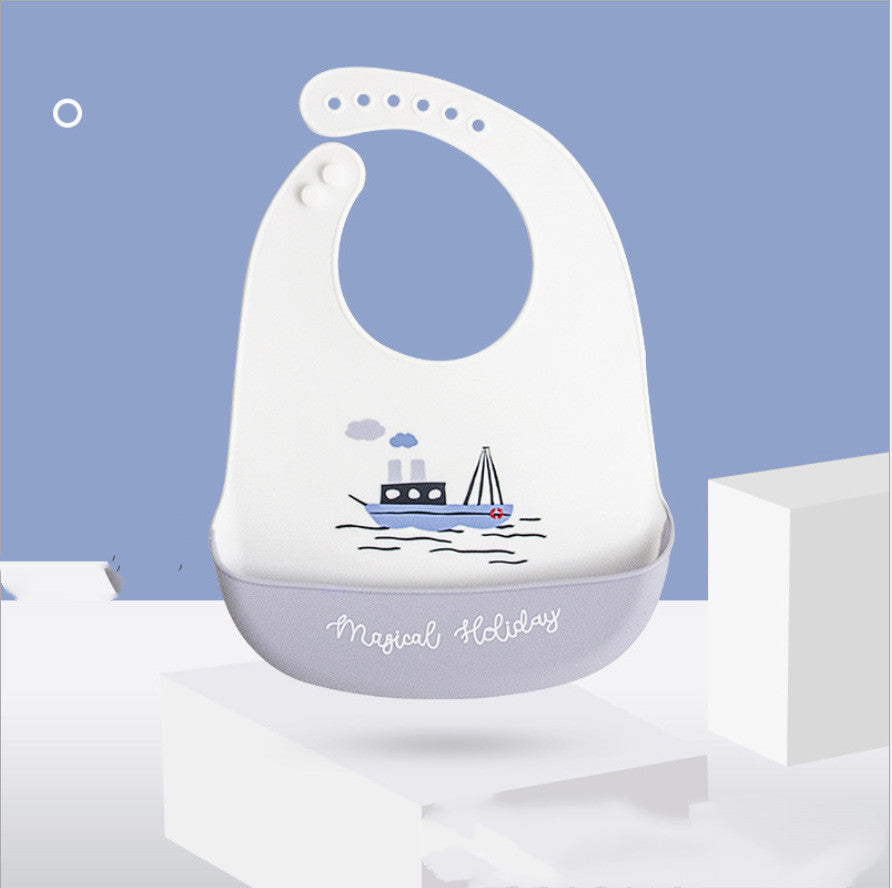 Baby bib with boat design on a blue background