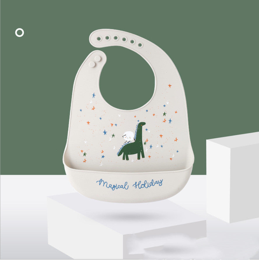 Baby bib with dinosaur design and 'Magical Holiday' text on a white background