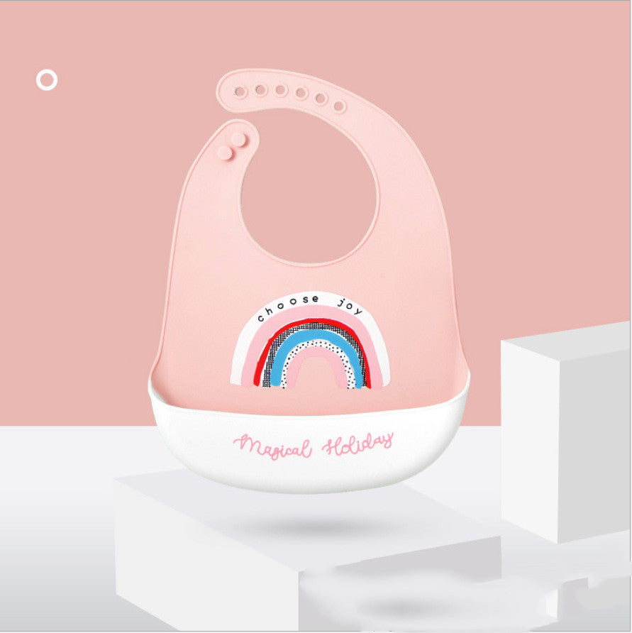 Pink bib with rainbow design and text on a pink background