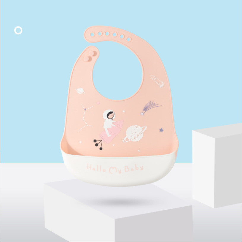 Pink baby bib with cartoon design on a light blue background