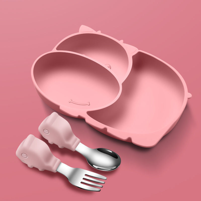 Pink children's plate with fork and spoon on a pink background