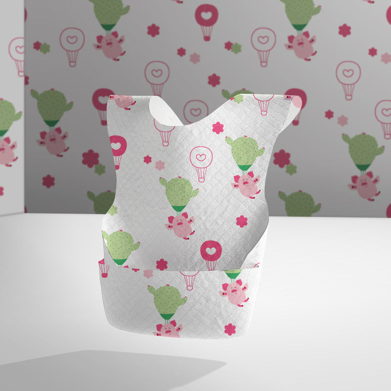 Baby bib with colorful patterns on a plain background