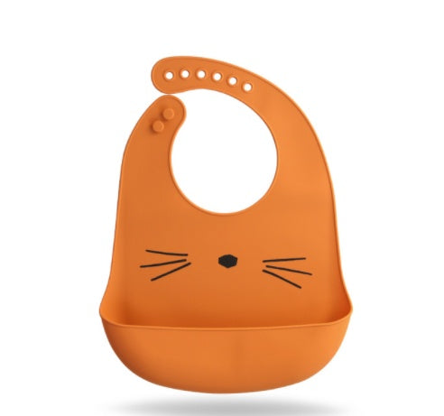Orange silicone bib with cat face design on a white background