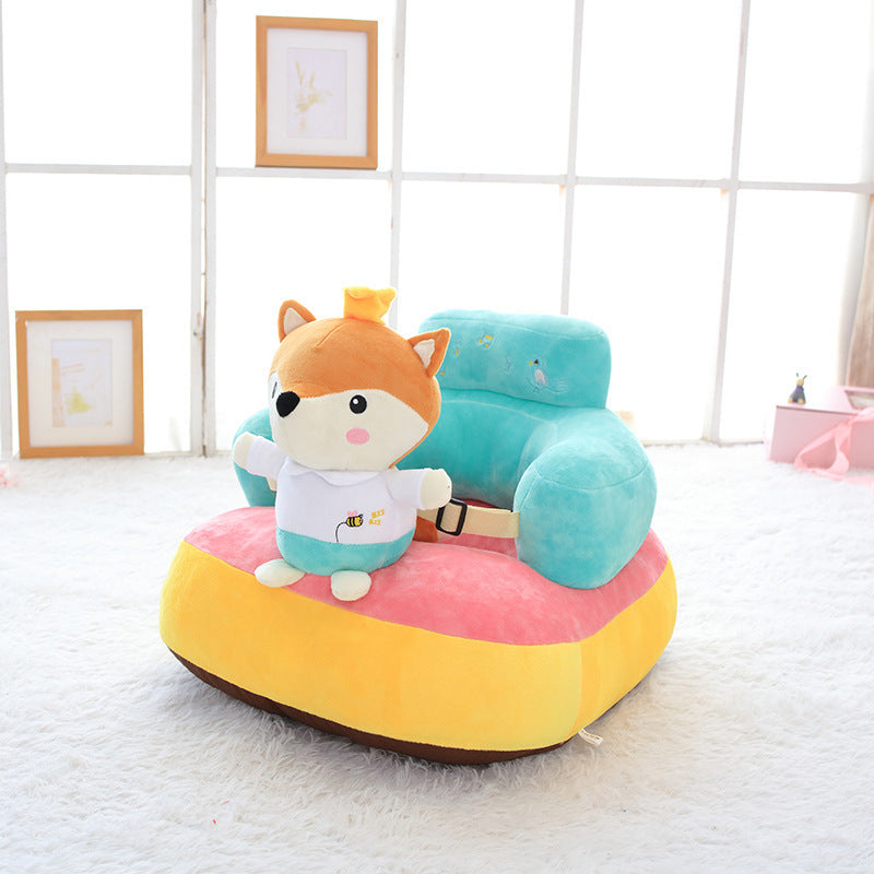 Colorful plush toy with cartoon character on a soft surface