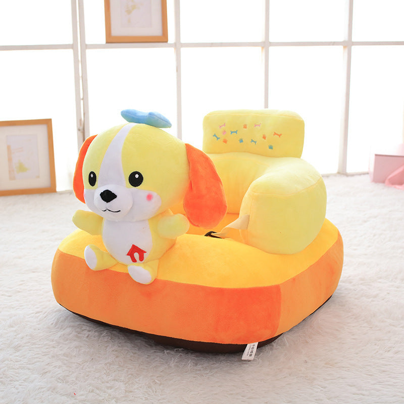 Children's plush chair shaped like a cartoon dog on a light-colored floor.