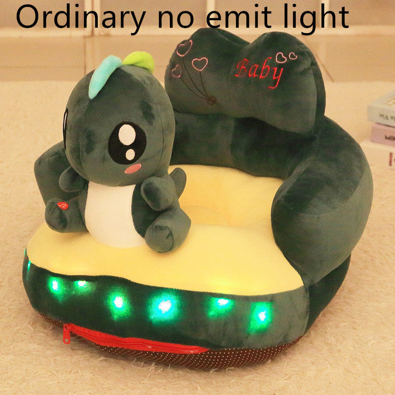 Plush toy with LED lights on a beige surface