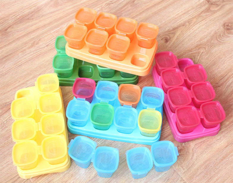 Colorful silicone ice cube trays on a wooden surface