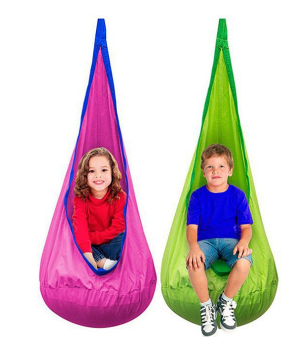 Two children sitting in colorful hanging chairs, one pink and one green, on a white background.