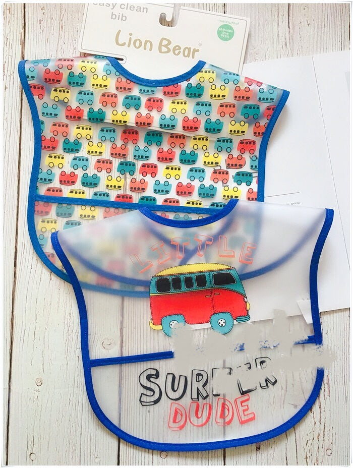 Colorful baby bib with vehicle pattern and 'Surf N' Dude' text on a white background