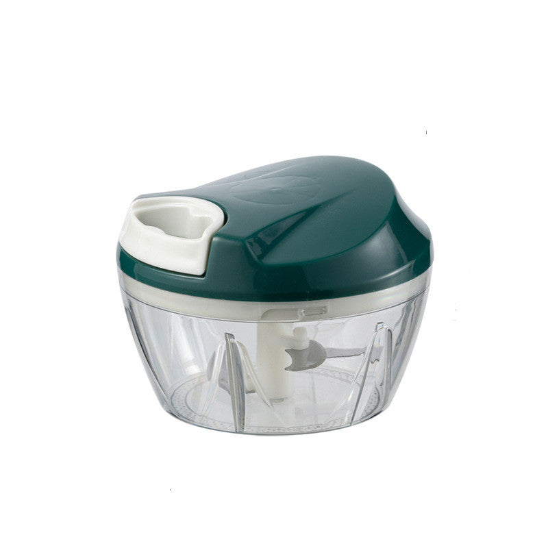 Handheld food chopper with green lid and clear container on a white background