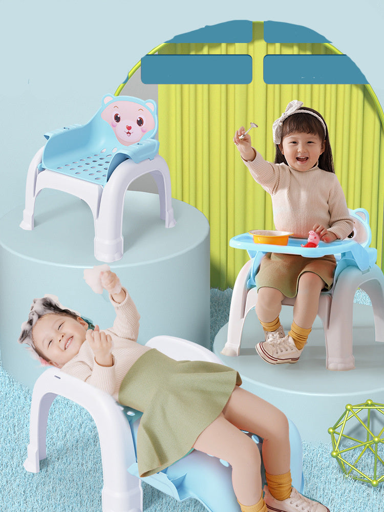 Children playing on colorful plastic chairs with cartoon character design in a playful setting.