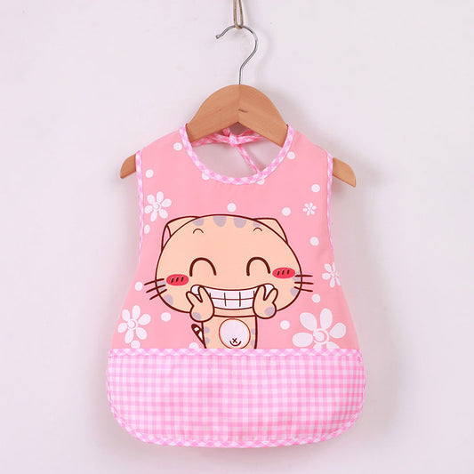 Pink children's apron with a cartoon cat design on a wooden hanger against a white background