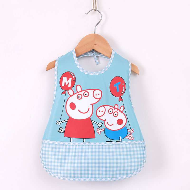 Children's bib with cartoon characters on a hanger against a white background