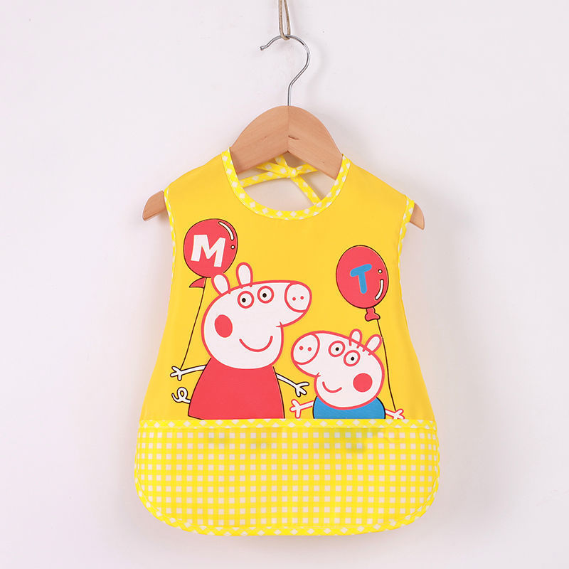 Yellow children's bib with cartoon character design on a hanger against a white background