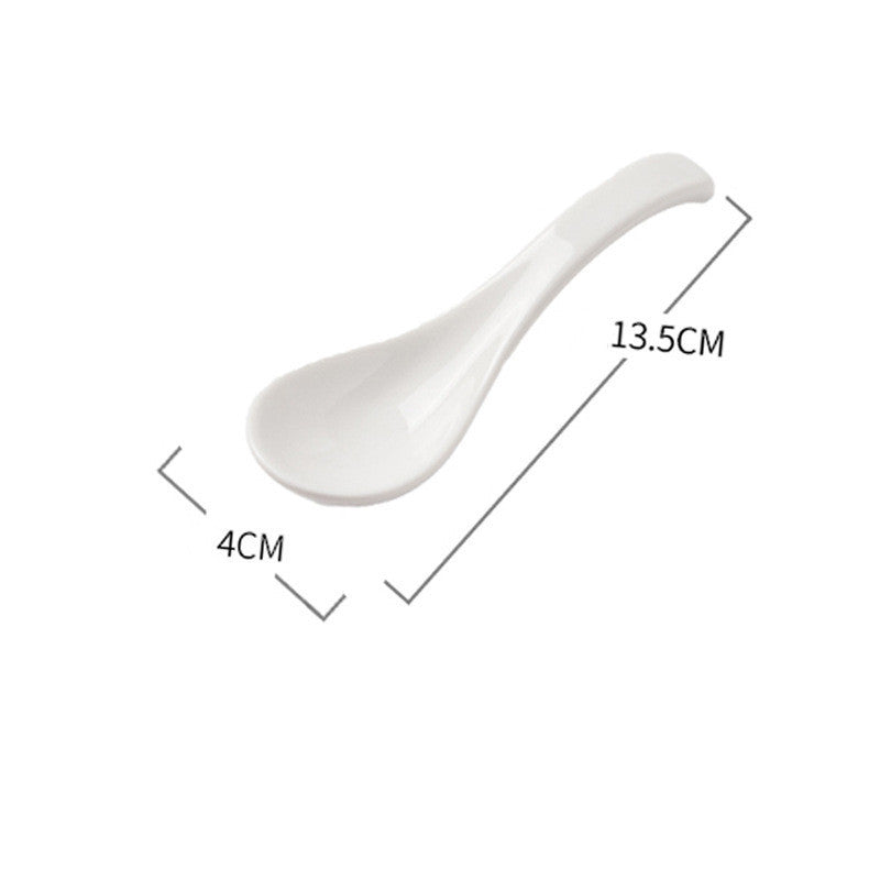 White ceramic spoon with dimensions labeled on a white background