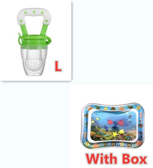 Baby fruit feeder with green handle and clear body, next to an inflatable pool with Doraemon design and text 'With Box'.