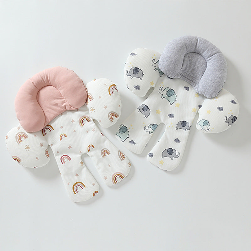 Set of baby pillows with elephant and rainbow patterns on a light gray background