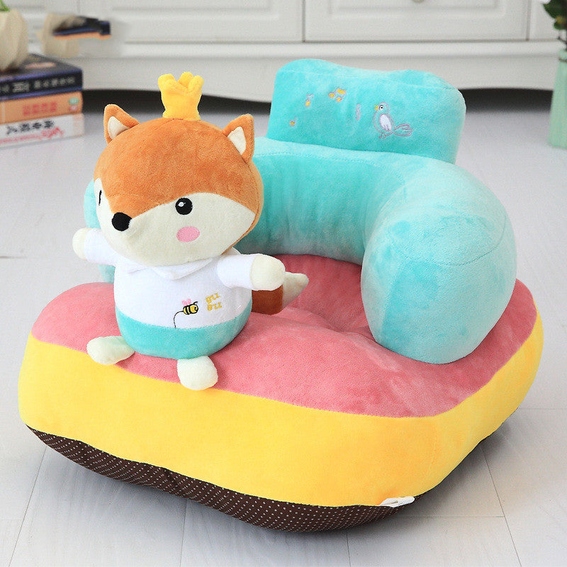 Children's plush toy with a cartoon character on a colorful chair-like seat.