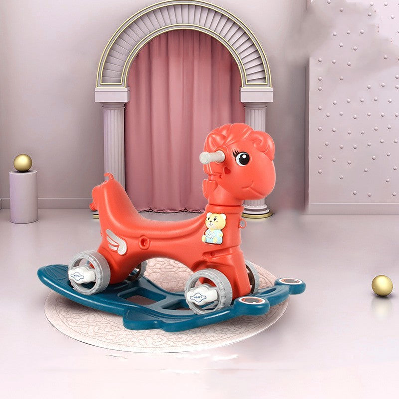Red rocking horse toy with blue base on a white platform