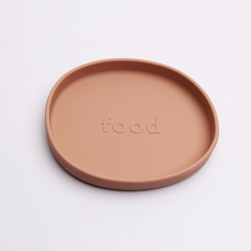 Brown ceramic plate with 'food' embossed on a white background