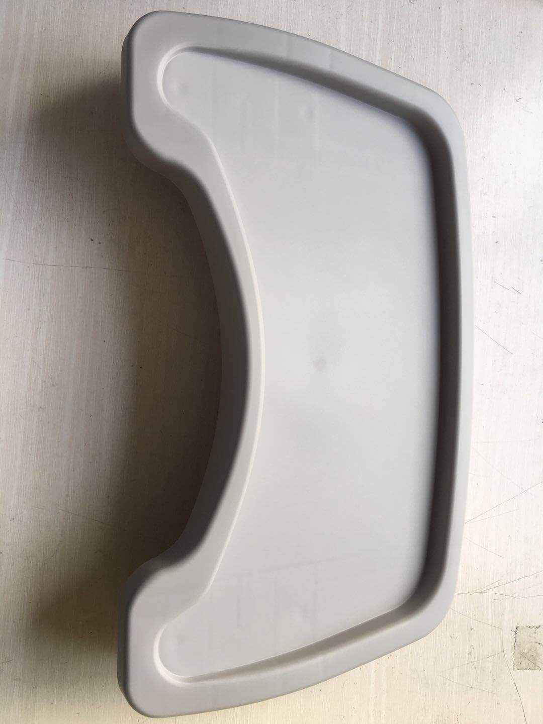 Gray plastic container lid on a light wooden surface