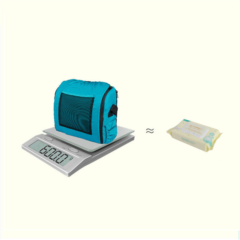 Blue bag on a digital scale with a packet of wipes next to it on a white background
