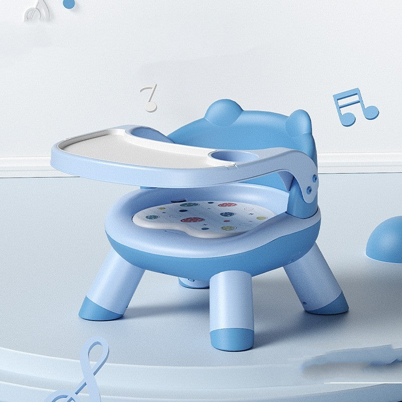 Blue children's chair with a tray on a light blue background