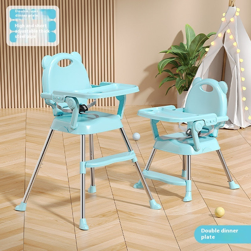 Two blue high chairs on a wooden floor with a plant in the background.