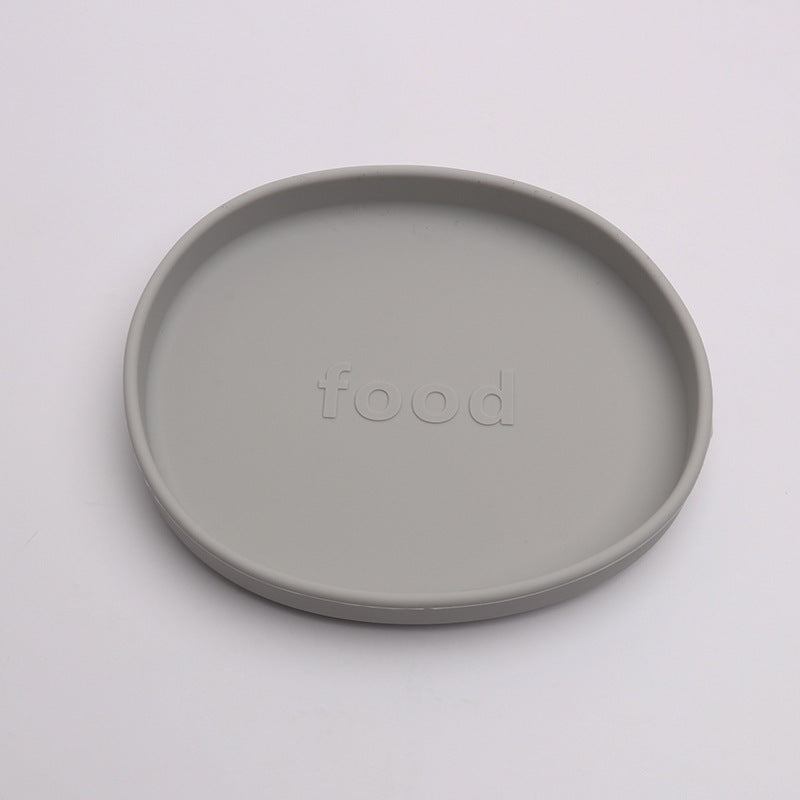 Gray ceramic plate with 'food' embossed on a white background
