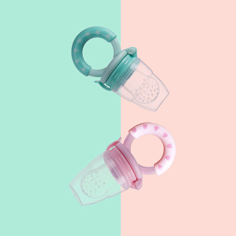 Two baby pacifiers on a split pink and green background