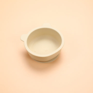 White ceramic cup on a beige background