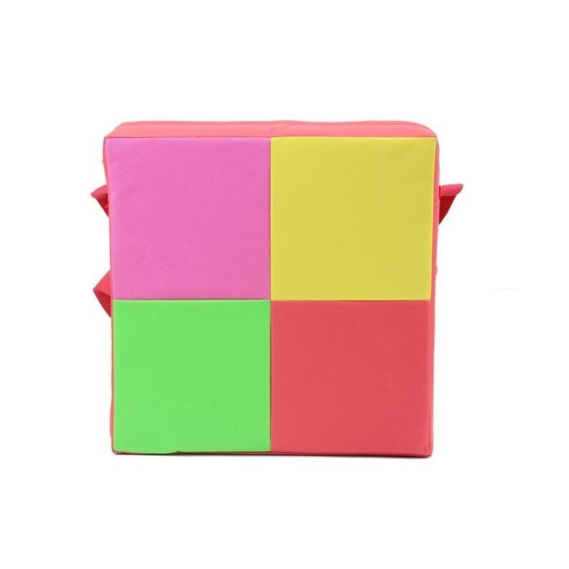 Colorful foam block with pink, yellow, green, and red sections on a white background