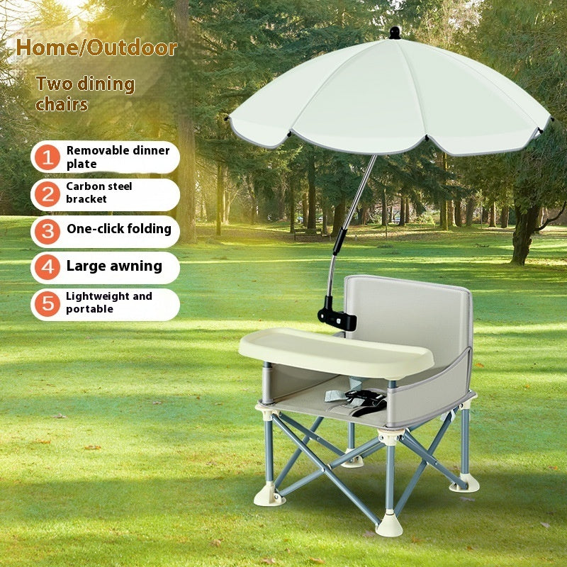 Portable dining chair with umbrella on a grassy outdoor area