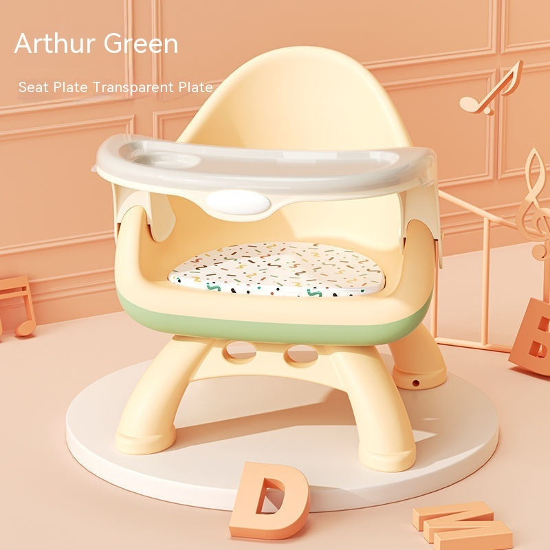 Children's training seat with transparent plate on a light pink background
