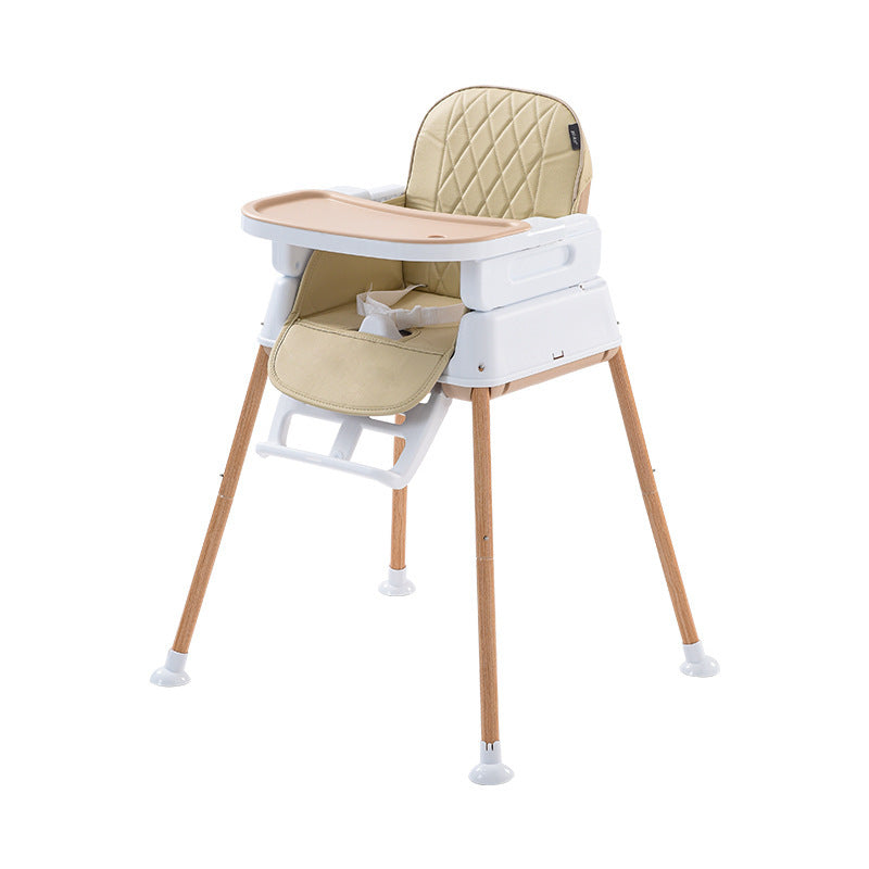 Beige and white high chair with wooden legs on a white background